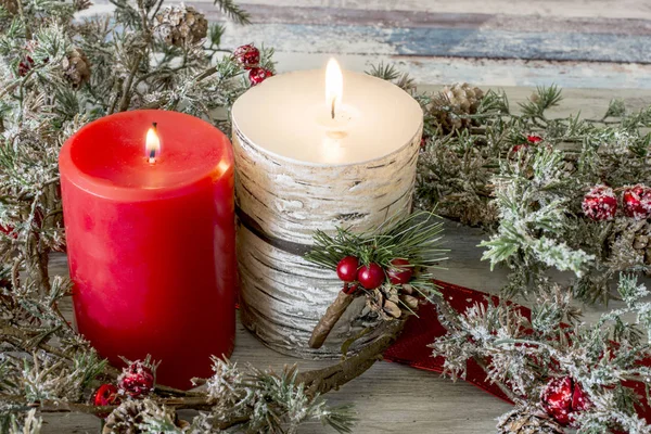 Lit candle and a stick of cranberries — Stock Photo, Image