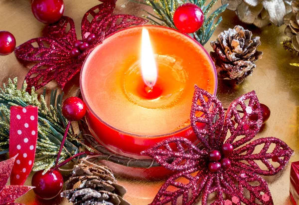 Wax candle with flame and  xmas decorations — Stock Photo, Image