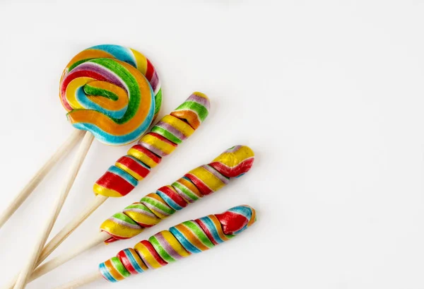 Several colorful lollipops on white background. — Stock Photo, Image