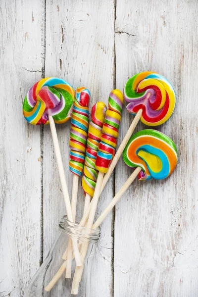 Several colorful lollipops on white background. — Stock Photo, Image