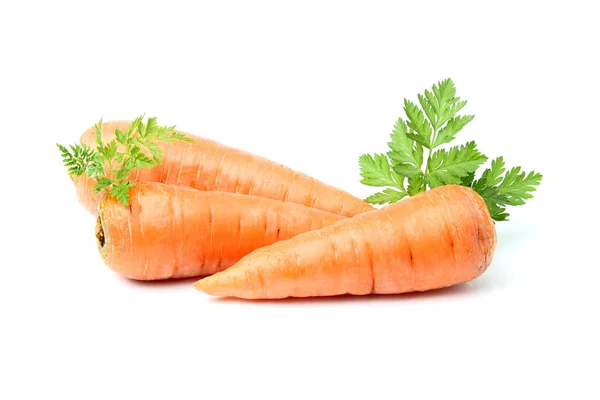 Three carrots with greens. — Stock Photo, Image