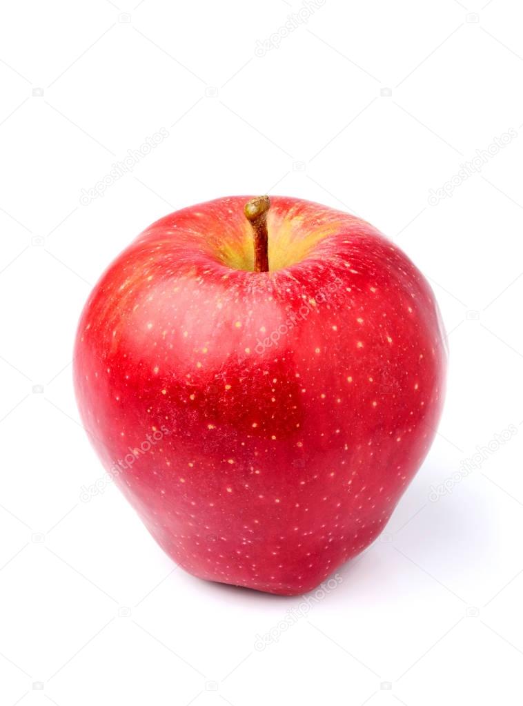 Red Apple lies vertically close-up isolated.