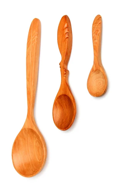 Tres cucharas de madera aisladas verticalmente . —  Fotos de Stock