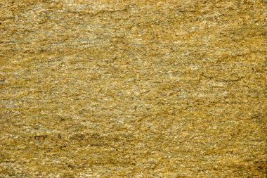 Taş altın benekler ile arka plan. Taş taş altın parçacıkları ile.