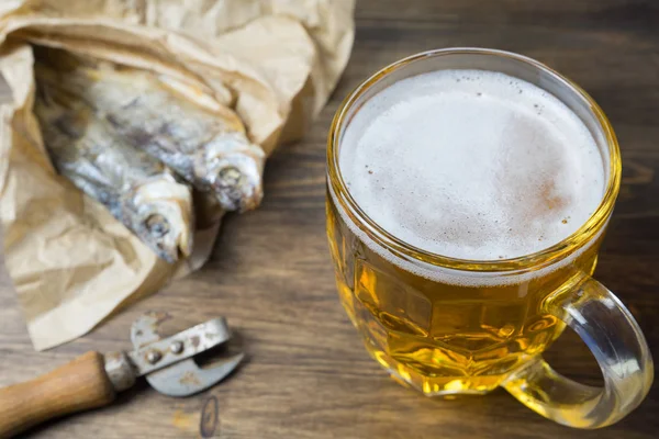 Traditional Russian snacks to beer. Dried roach on paper.