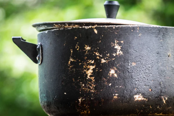 A dirty old metal pot. Close-up photo. — Stock Photo, Image