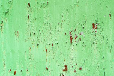 Eski boyalı metal bir fotoğraf. Boyanın altındaki pas..