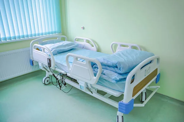 Empty hospital ward with patients bed