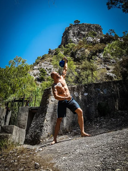 Holding a Kettlebell Overhead — Stock Photo, Image