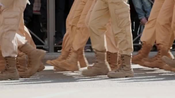 Slow motion of military legs marching along the street clone rhythm close up. — Stockvideo