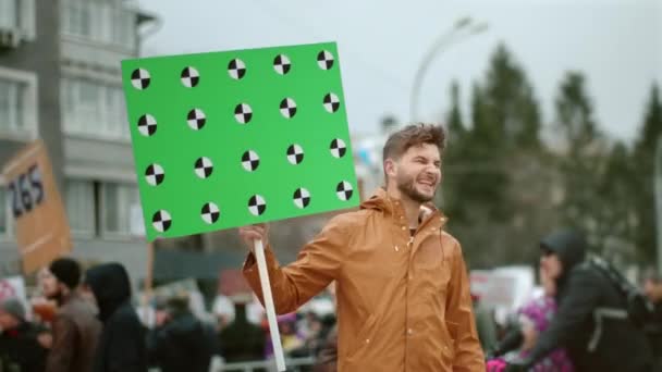 Angry man activist on political strike. People with banner tracking points 4k. — Stock Video