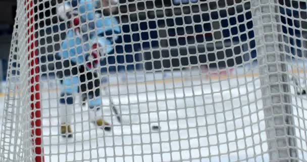 Hit puck male player hockey in gate closeup man score goal slow motion. Rink 4K. — 비디오