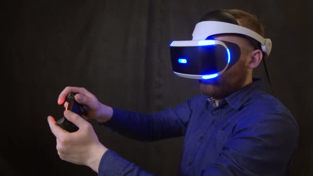 People vr helmet closeup takes joystick in hand examines digital space around 4K — Stock Video