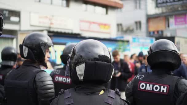 Helmet group armed policemen on street closeup protection order. Riot people. — Stockvideo