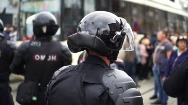 Helmet group armed policemen on street closeup protection order. Riot people.