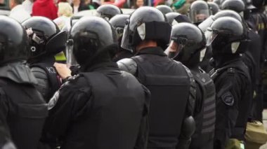 Walking group special forces on street city in helmet closeup strike people 4K.