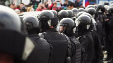 Helmet armed special forces on street close up protect order 4K. Strike man.