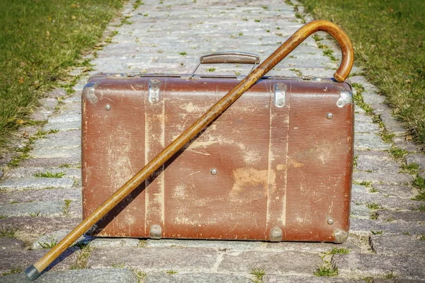 Old suitcase with walking stick — Stock Photo, Image