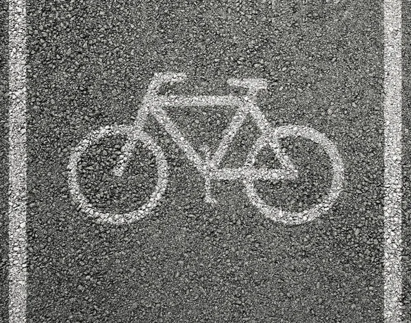 Bicycle sign on asphalt — Stock Photo, Image