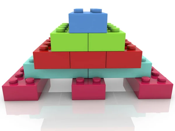 Pyramid of toy bricks in various colors on white — Stock Photo, Image