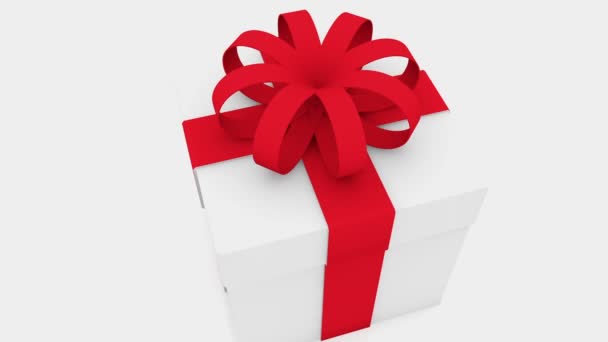 Confezione regalo con nastro rosso su bianco — Video Stock