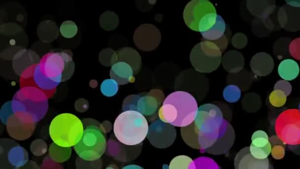 Fallande cirklar i olika färger på svart — Stockvideo