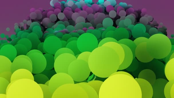 Lassan mozgó karikák, zöld és lila színekben — Stock videók