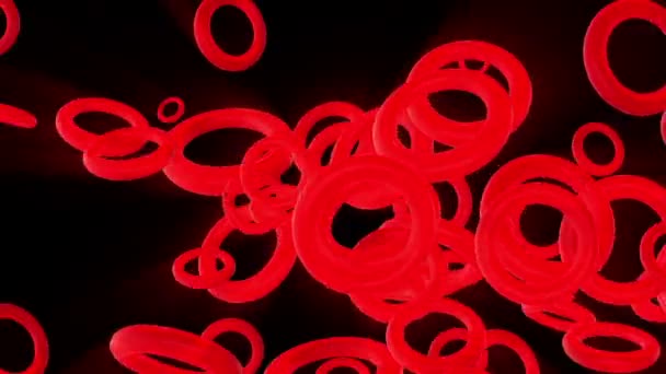 Anelli a rotazione lenta in rosso neon su nero — Video Stock