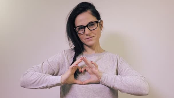 Woman Shoving Heart Sign — Stock Video