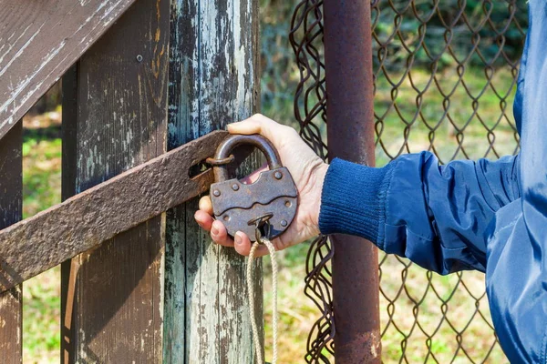 Woman Closes Lock — Stock Photo, Image