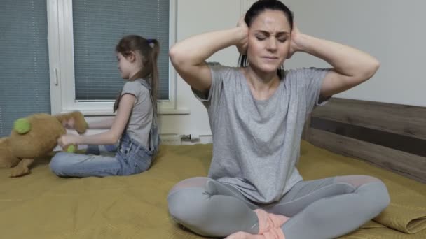 Shocked Mother Closing Ears Hear Noisy Stubborn Little Girl — Stock Video