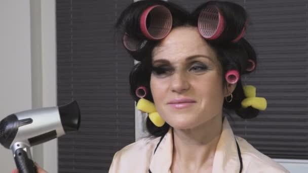 Woman Hair Rollers Using Hair Dryer — Stock Video