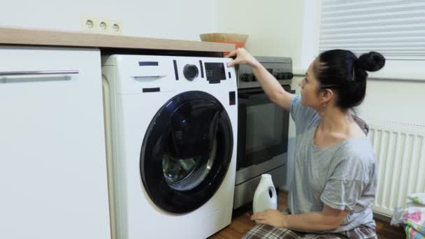 Woman Sitting Trying Torn Broken Washing Machine — Stock Video