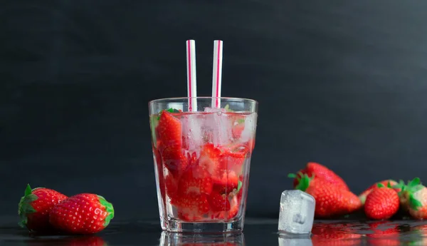 strawberry cocktail with strawberry on a black background