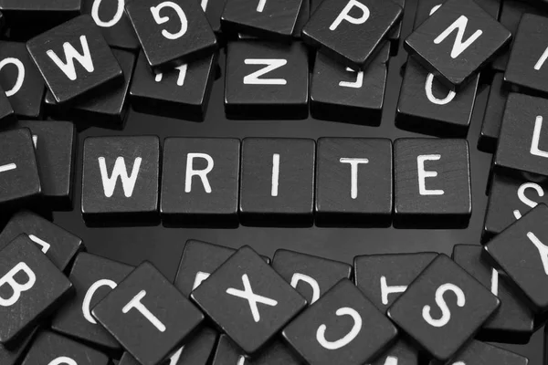 Black letter tiles spelling the word "write" — Stock Photo, Image