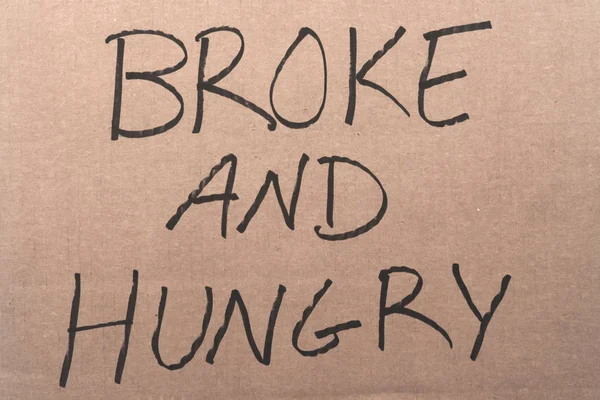 Broke and hungry cardboard sign