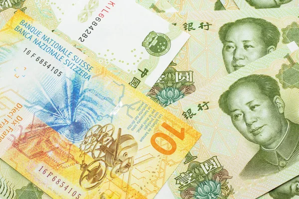 Žlutá Deset Švýcarských Franků Švýcarska Zblízka Makru Čínskými Jednojuanovými Bankovkami — Stock fotografie