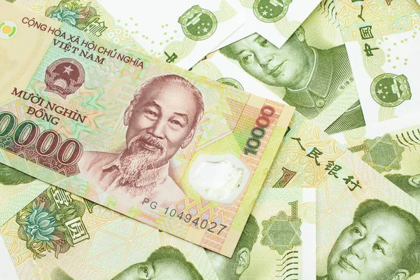 Detailní Záběr Vietnamskou Desetitisícovou Bankovku Pozadí Čínských Jednojuanových Bankovek Makru — Stock fotografie