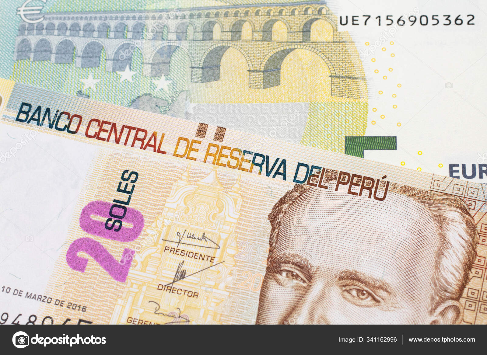 A pastel colored, twenty Peruvian sol bank note, close up in macro with a red, European five euro bill 9 A pastel colored, twenty Peruvian sol bank note, close up in macro with a red, European five euro bill 9