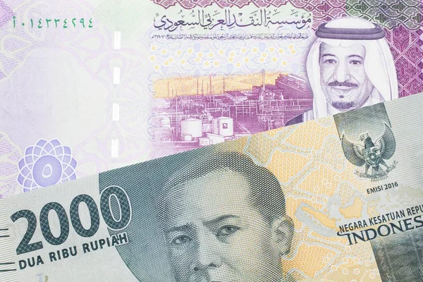 Gray Two Thousand Indonesian Rupiah Bank Note Five Saudi Riyal — Stock Photo, Image