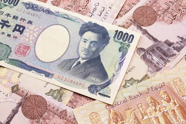 Tysiąc Japońskich Jenów Zamkniętych Makro Egipskimi Banknotami — Zdjęcie stockowe