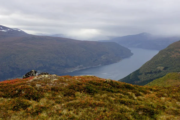 Scenic view of valley and nordfjord from a mountop near via ferrata at Loen, Norway with mountains in the background.heavy cloud cover in oktober morning, norvégkültéri szépség — Stock Fotó