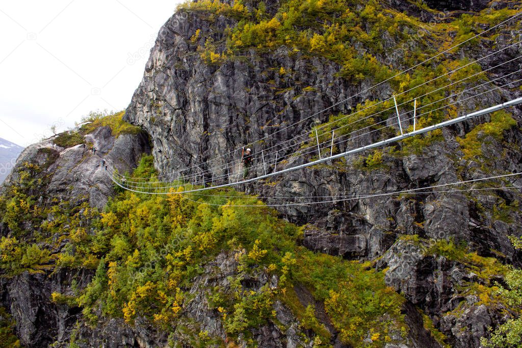 Beautiful view on the top of via ferrata Loen Norway with suspension bridge in autumn,scandinavian nature,outdoor activity,norwegian lifestyle