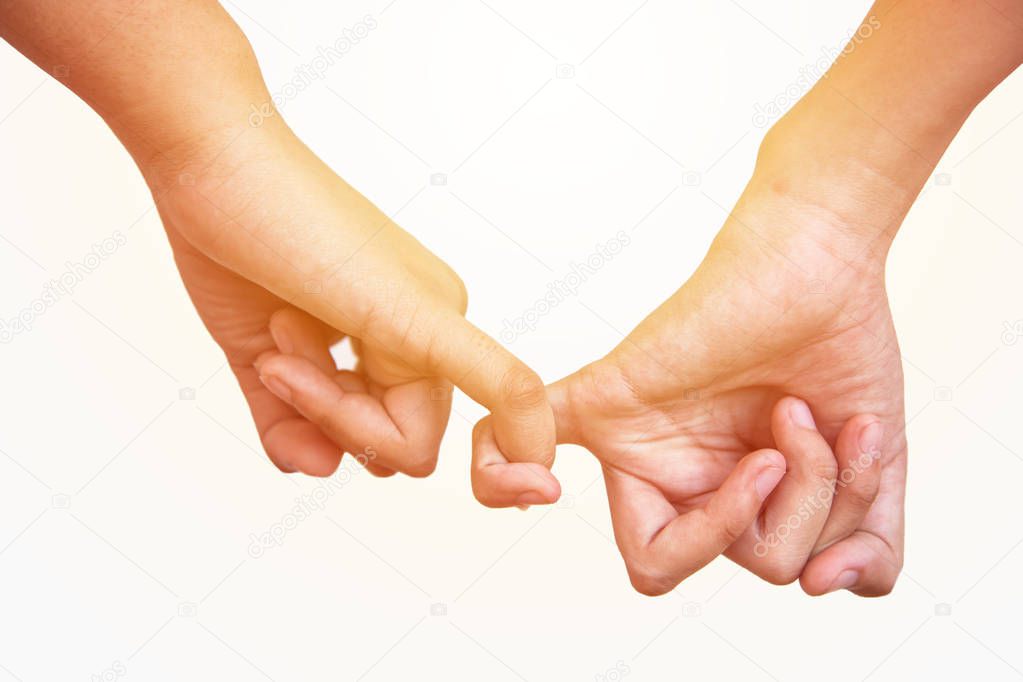 hands making promise as afriendship concept on white background