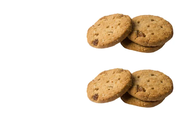 Biscuits à l'avoine aux raisins secs et aux amandes sur le dessus isolés au fouet — Photo