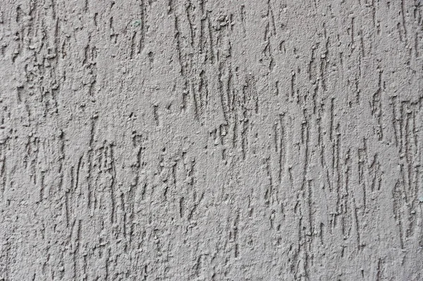 Abstrakte Zementwand mit Furchen und Unregelmäßigkeiten — Stockfoto