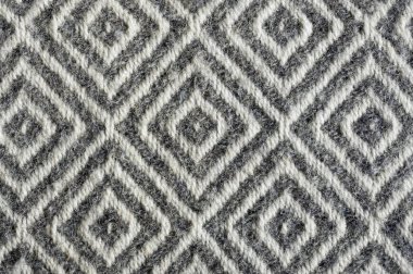 Woolen fabric texture close-up. Gray contrast diamond pattern clipart