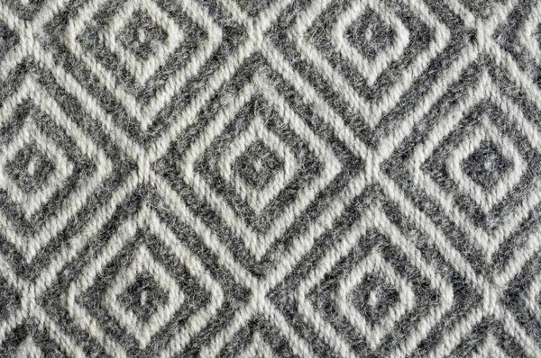 Textura de tela de lana de cerca. Patrón de diamante gris contraste Imágenes de stock libres de derechos