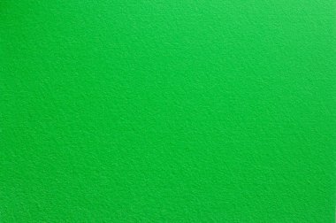 Açık yeşil renkli yüzey hissettim. Arka plan ve tasarım için doku.