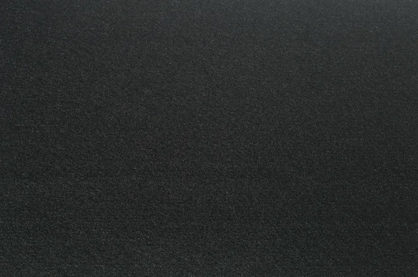 Siyah renkli yüzey hissettim. Arka plan ve tasarım için doku.